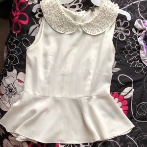 White sleeveless blouse